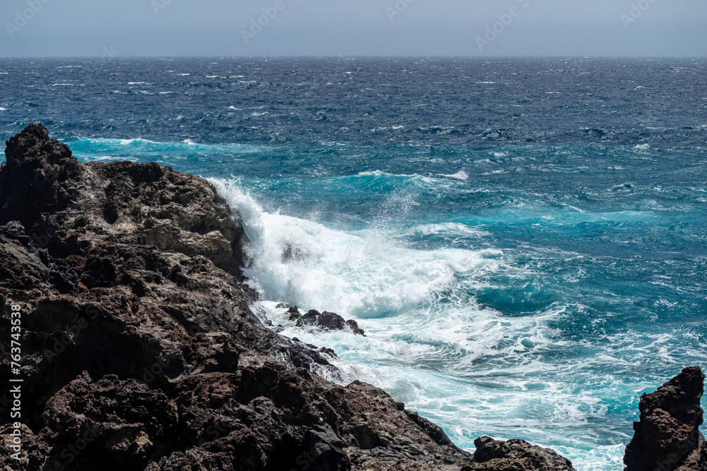 big ocean waves crashing on rocks