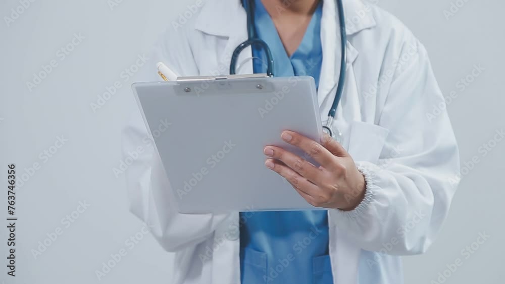 Content young female doctor posing at camera. Pretty woman wearing white coat and standing. Medicine and healthcare concept. Isolated front view on white background. Content young female doctor posing at camera. Pretty woman wearing white coat and standing. Medicine and healthcare concept. Isolated front view on white background.