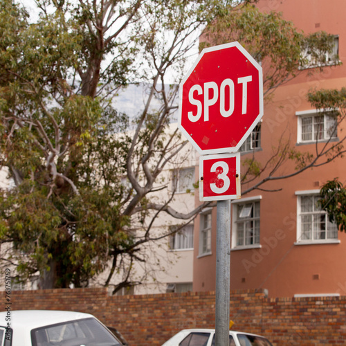 Road, city and outdoor with stop sign, mistake or typo for humor with comic text in neighborhood. Spot, error and joke with funny signage with writing, language or wrong spelling for warning in town