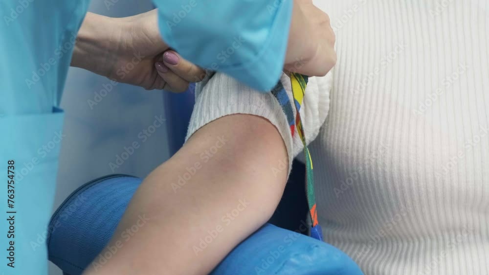 Injections for blood collection. A nurse or paramedic prepares a patient to donate blood. Preparing for a blood test. Blood donation concept, tests, research. Injections for blood collection. A nurse or paramedic prepares a patient to donate blood. Preparing for a blood test. Blood donation concept, tests, research.