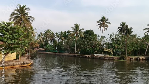 Alleppey India houseboat sailing among canals and rice fields photo