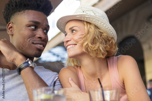 close view of a multiracial couple in a bar