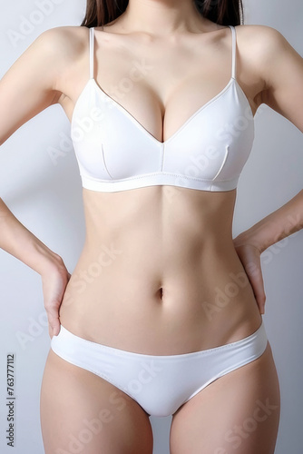 ダイエット・トレーニング・美容整形の女性の上半身の素材写真（白背景）