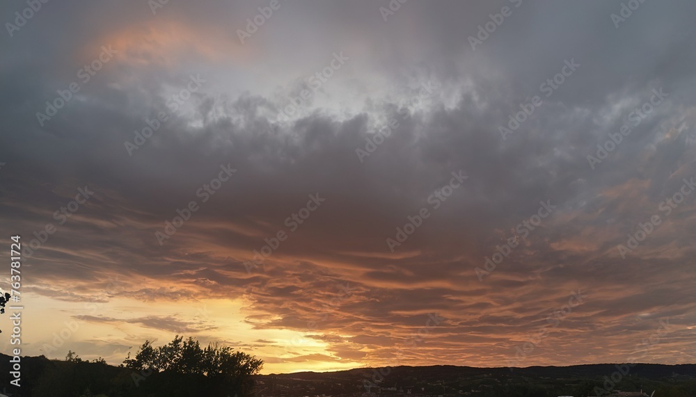 A dramatic cloudy sky during golden hour