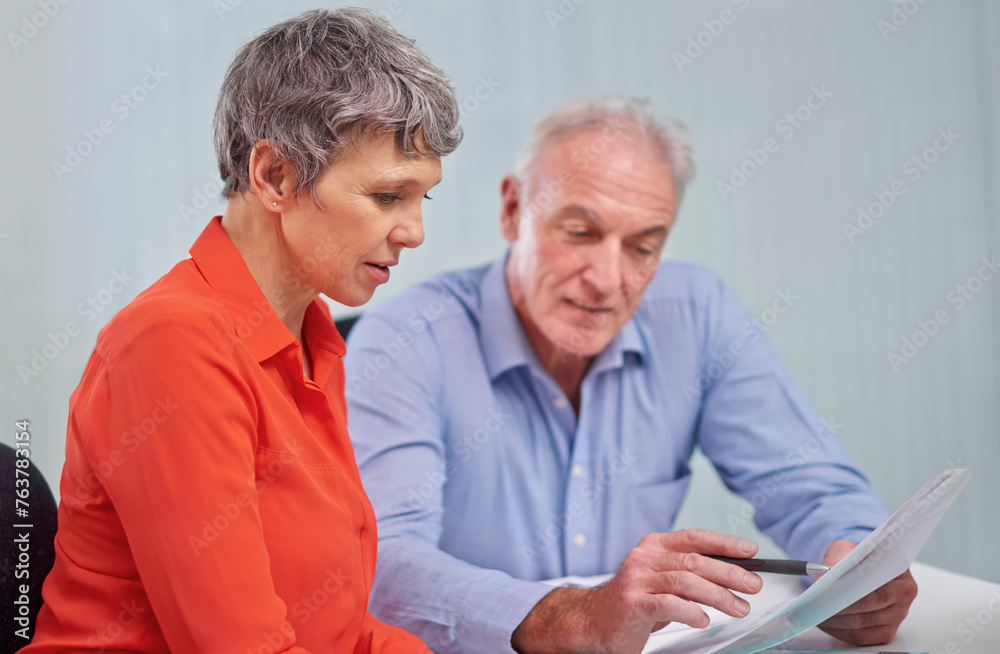 Documents, planning and senior woman with financial advisor in discussion for pension fund in office. Conversation, paperwork and elderly female person with finance consultant for retirement savings. Documents, planning and senior woman with financial advisor in discussion for pension fund in office. Conversation, paperwork and elderly female person with finance consultant for retirement savings.