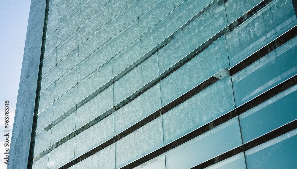 The edge of a building facade with glass plates on it in Madrid The edge of a building facade with glass plates on it in Madrid