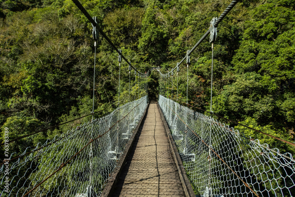 Crossing a suspension bridge to Zhuilu Old Trail, Taroko National Park, Taiwan 