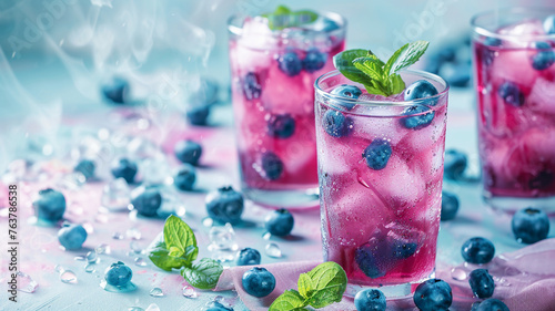 Blueberry juice in glasses on a minimal pastel background © FATHOM
