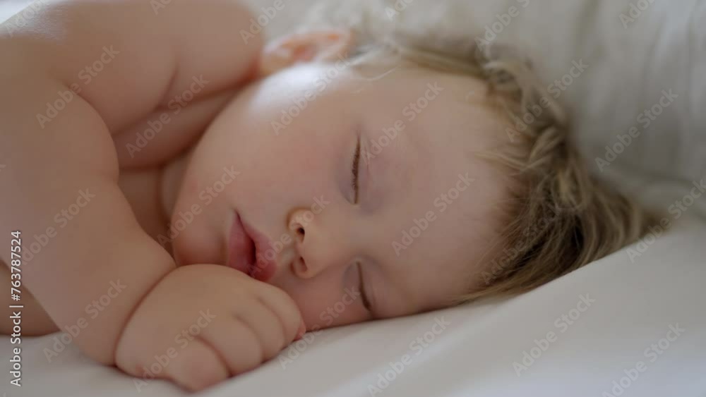 Peaceful baby boy sleeping bed in room. One year-old babyboy sleep home cute little toddler sleeps sweetly in crib sees colorful dream Sleeping baby happy and carefree in bed. Happiness sleep children Peaceful baby boy sleeping bed in room. One year-old babyboy sleep home cute little toddler sleeps sweetly in crib sees colorful dream Sleeping baby happy and carefree in bed. Happiness sleep children