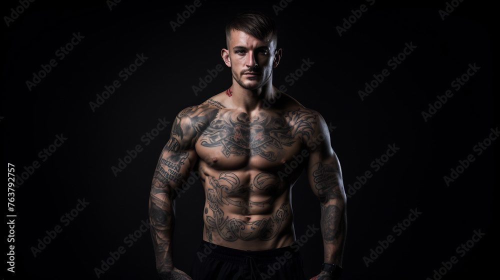 Portrait of a Muscular Tattooed Man with a Focused Expression in Low Key Lighting, Emphasizing the Art of Body Ink and Physical Fitness