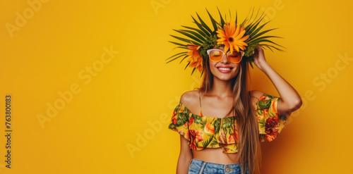 A young woman standing with a flower crown on her head photo