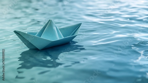 Paper Boat on Calm Blue Waters © Kunlapat
