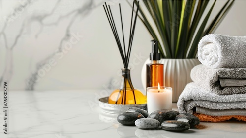 spa equipment with flower candles and towels on the table