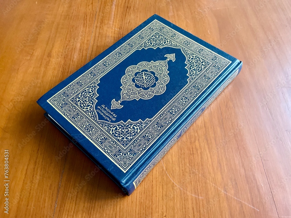 The Quran, also romanized Qur'an or Koran, is central religious text of Islam, believed by Muslims to revelation from God (Allah). Classical Arabic. Wood wooden. The Quran, also romanized Qur'an or Koran, is central religious text of Islam, believed by Muslims to revelation from God (Allah). Classical Arabic. Wood wooden.