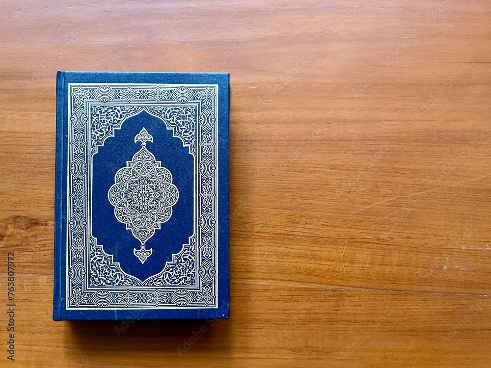 The Quran, also romanized Qur'an or Koran, is central religious text of Islam, believed by Muslims to revelation from God (Allah). Classical Arabic. Wood wooden. The Quran, also romanized Qur'an or Koran, is central religious text of Islam, believed by Muslims to revelation from God (Allah). Classical Arabic. Wood wooden.
