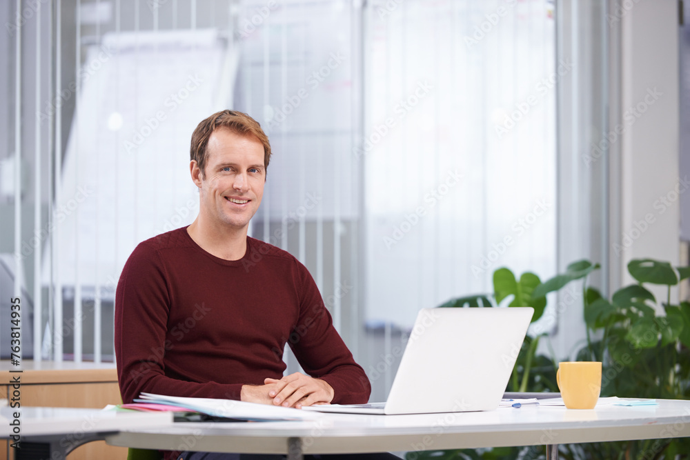 Portrait, smile and business man on laptop at desk in office for creative career in startup company. Face, employee or happy professional on computer at table, copywriter or entrepreneur in Australia Portrait, smile and business man on laptop at desk in office for creative career in startup company. Face, employee or happy professional on computer at table, copywriter or entrepreneur in Australia
