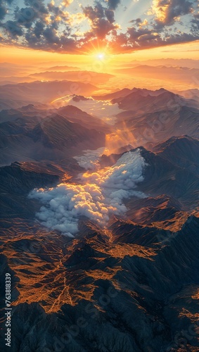 Captivating aerial view of a majestic mountain range bathed in golden sunrise light, revealing intricate terrains and valleys
