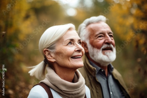 portrait of a senior woman enjoying a nature walk with her husband in the outdoors