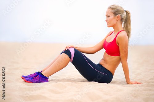 Fitness, thinking and woman on beach for exercise, training and workout in nature. Summer, sports and person on sand for warm up, resting and relax for wellness, health and performance by ocean