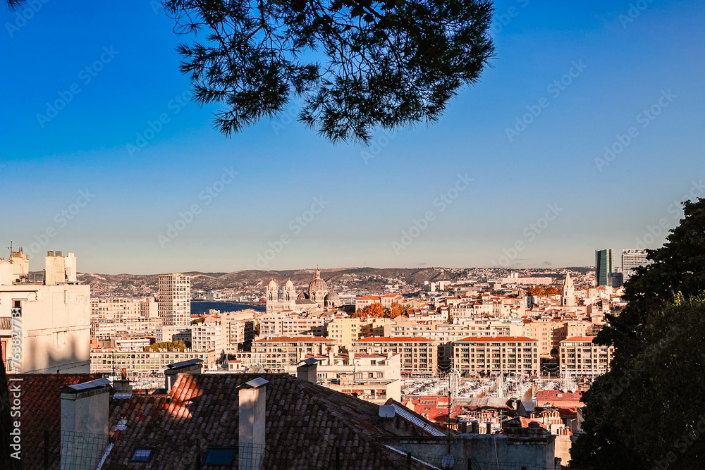 Panoramic view of Marseille from top Notre Dame de la Garde hill. City skyline with houses, streets and mountains, Marseille, France
