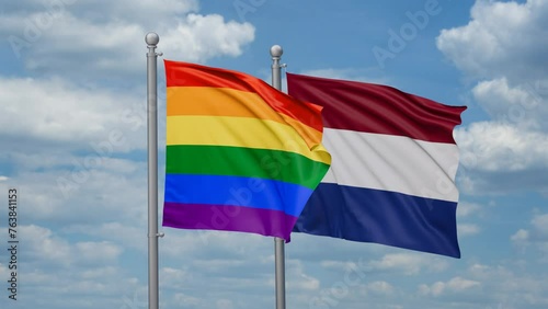 Netherlands and LGBT movement flag also Gay Pride  two flags waving together, looped video, two country relations concept photo