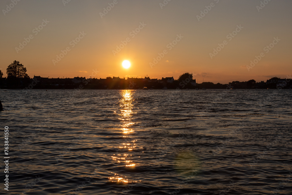 Naklejka premium sunset over the river