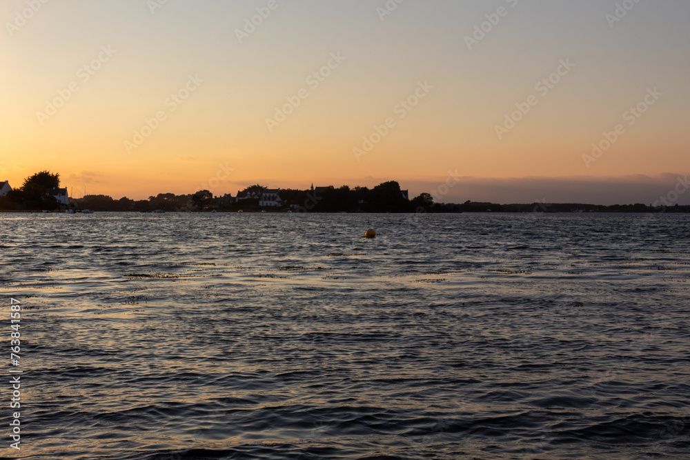 Naklejka premium sunset over the river