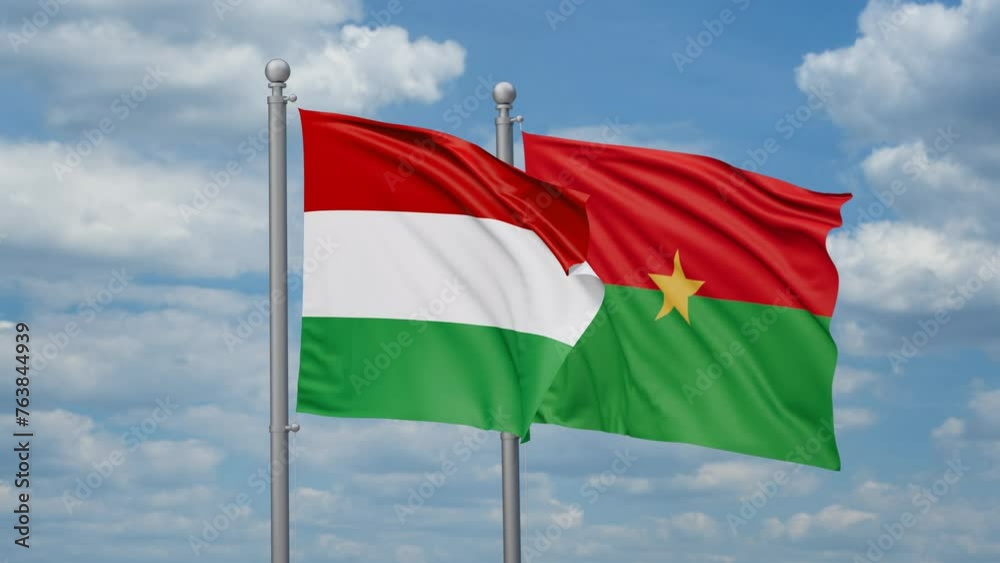 Burkina Faso and Hungary two flags waving together, looped video, two country relations concept Burkina Faso and Hungary two flags waving together, looped video, two country relations concept