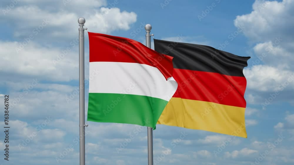Germany and Hungary two flags waving together, looped video, two country relations concept Germany and Hungary two flags waving together, looped video, two country relations concept