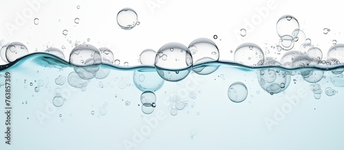 Small spherical air pockets moving in the liquid against a backdrop of vivid blue color