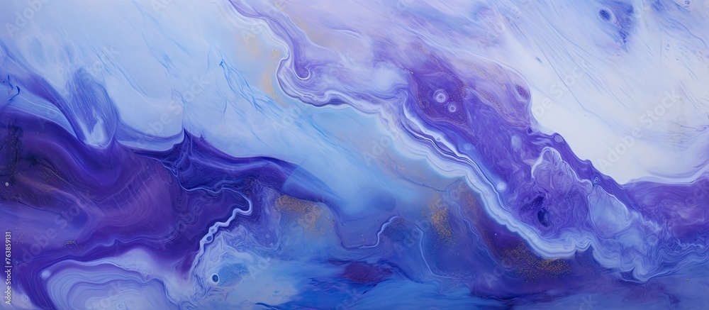A close up of a painting of purple and blue fluid art