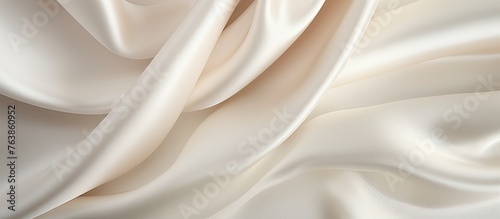 Capture of a white fabric intricately folded with numerous creases taking up the entire frame