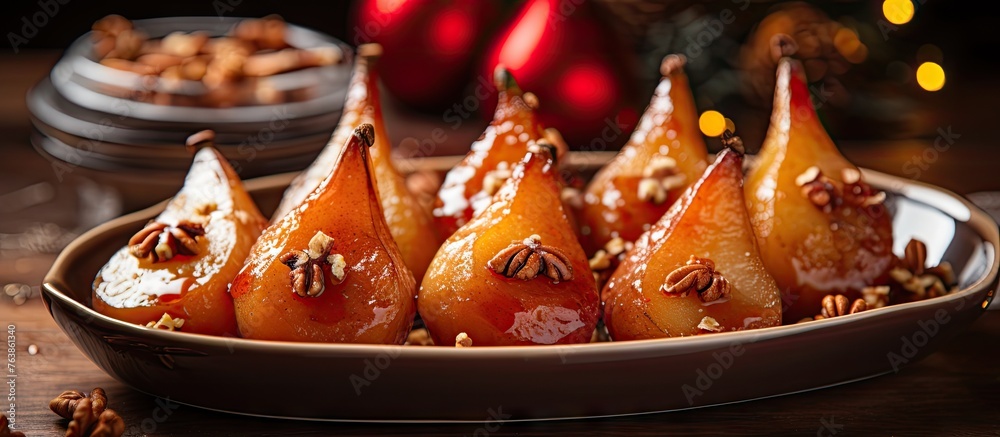 Plate of fresh pears and nuts, glazed roasted pears with nut sprinkles on a table Plate of fresh pears and nuts, glazed roasted pears with nut sprinkles on a table