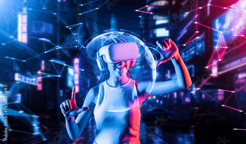 Female stand in cyberpunk style building in meta wear VR headset connecting metaverse, future cyberspace community technology, Woman use thumb and index fingers focus 3d hologram globe. Hallucination. © Summit Art Creations