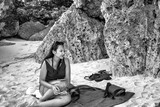 Two beautiful indonesian girls relaxing on the beach in Bali