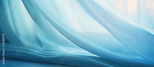 A detailed view of a vibrant blue curtain as light filters through, creating a soft glow
