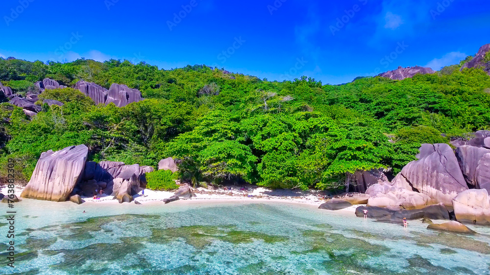 Anse Source D'Argent Beach in La Digue, Seychelles. Aerial view of tropical coastline on a sunny day