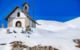 A small Church on a mountain peak in winter season