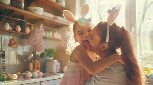 A woman holds a little girl in bunny ears, sharing a happy moment in the kitchen