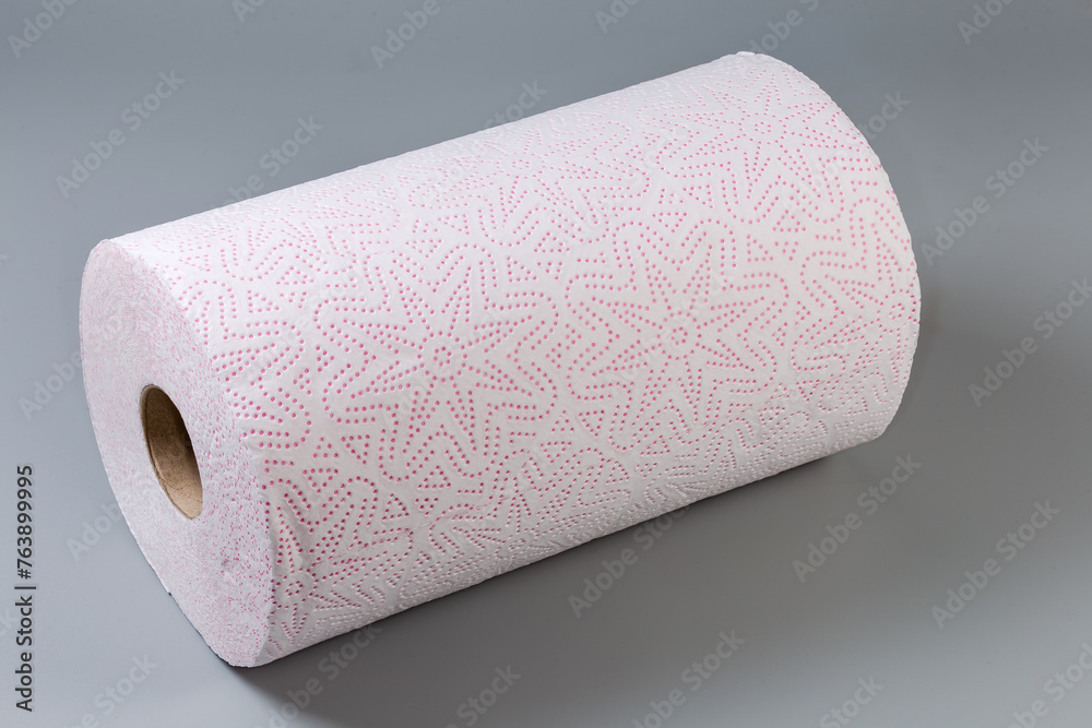 Fototapeta premium Roll of tear-off paper towels on a gray surface