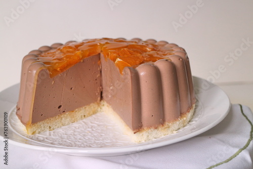 chocolate souffle cake with oranges, white dish, side view