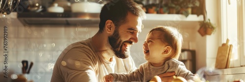 Joyful father and toddler laughing together in a sunlit cozy kitchen