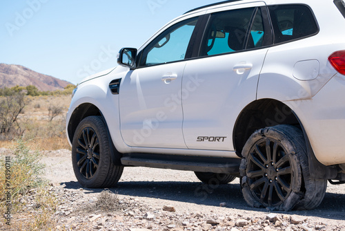 Outback Roadside Trouble: Flat Tire on SUV