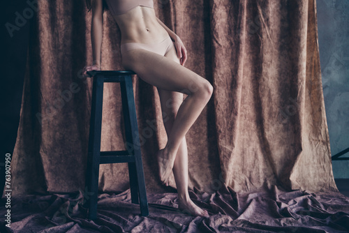 Cropped photo with no retouch of stunning gorgeous lady posing sitting stool enjoying hair removal therapy isolated studio background © deagreez