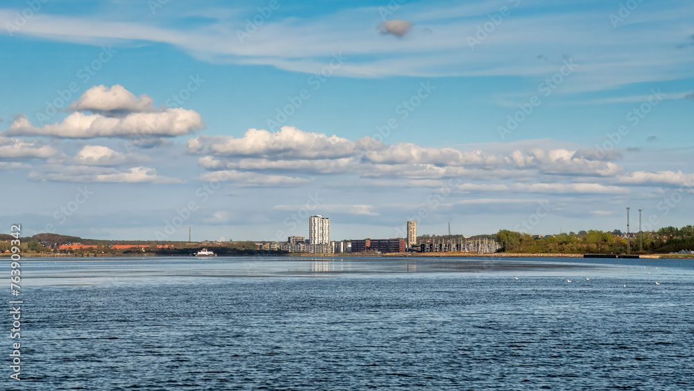 Aalborg and Nørresundby skyline along Limfjord under blue sky, Nordjylland, Denmark