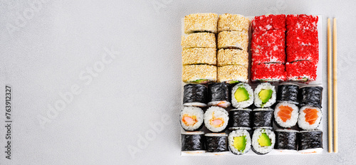 Popular types of sushi. Set of sushi roll on a gray background. Top view.