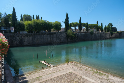 Fototapeta Naklejka Na Ścianę i Meble -  moat around the walls of Peschiera del Garda on a sunny day