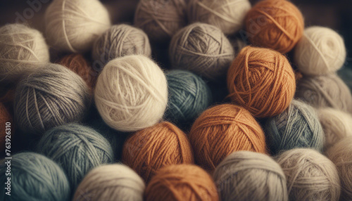 Vintage toned picture of wool yarn balls, craft natural colored knitting hobby backgrounds