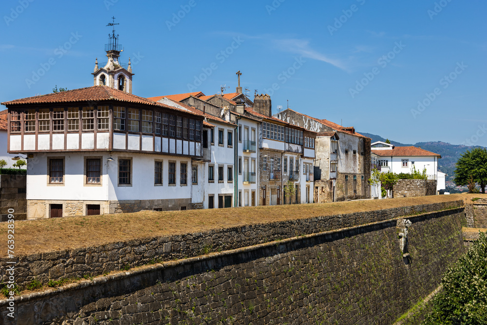 Old Valença Fortress wall, street with traditional houses. Valença, Portugal.
