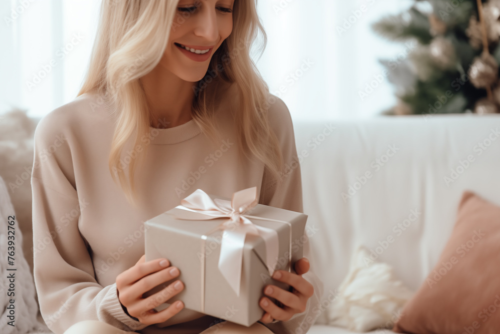 Woman Holding a Gift Box with Elegant Ribbon Woman Holding a Gift Box with Elegant Ribbon